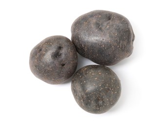 Photo of Fresh purple potatoes isolated on white, top view
