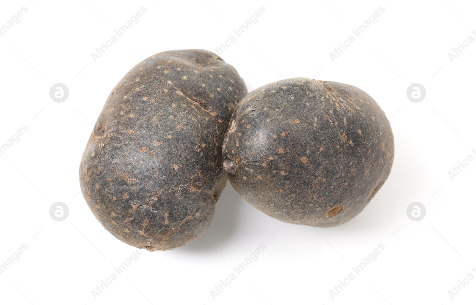 Photo of Fresh purple potatoes isolated on white, top view