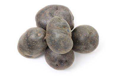 Photo of Fresh purple potatoes isolated on white, top view