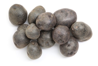 Photo of Fresh purple potatoes isolated on white, top view