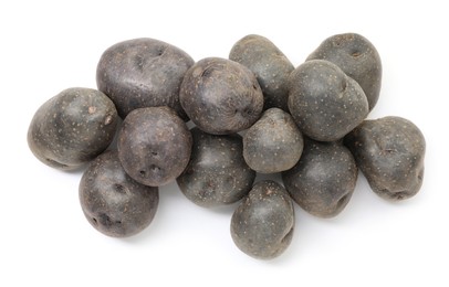 Photo of Fresh purple potatoes isolated on white, top view