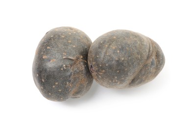 Photo of Fresh purple potatoes isolated on white, top view