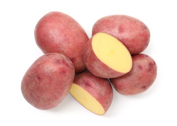 Photo of Whole and cut fresh red potatoes isolated on white, top view
