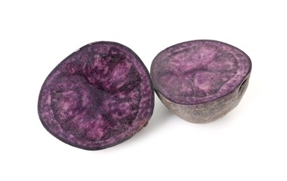 Photo of Cut fresh ripe purple potato isolated on white