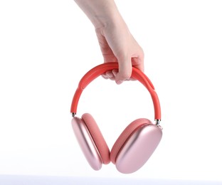 Photo of Woman with stylish pink headphones on white background, closeup