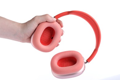 Photo of Woman with stylish pink headphones on white background, closeup