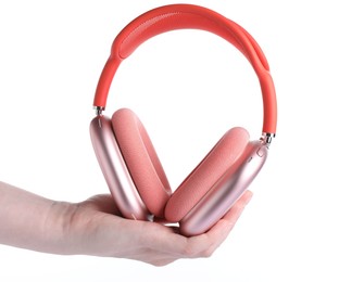 Photo of Woman with stylish pink headphones on white background, closeup