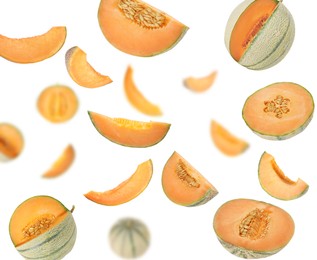 Image of Tasty ripe Cantaloupe melons swirling in air against white background