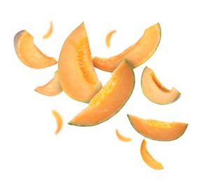 Image of Cut fresh ripe melons swirling in air against white background