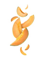 Image of Cut fresh ripe melons swirling in air against white background