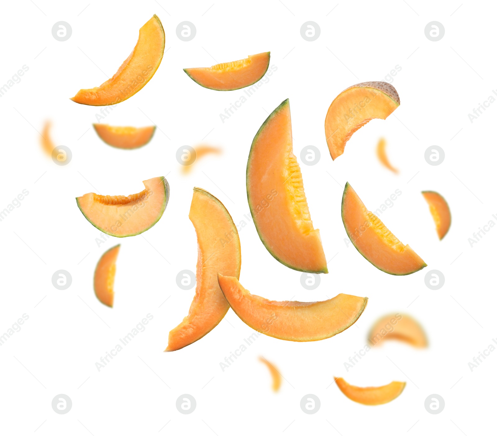 Cut fresh ripe melons swirling in air against white background Image of Cut fresh ripe melons swirling in air against white background