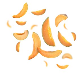 Image of Cut fresh ripe melons swirling in air against white background