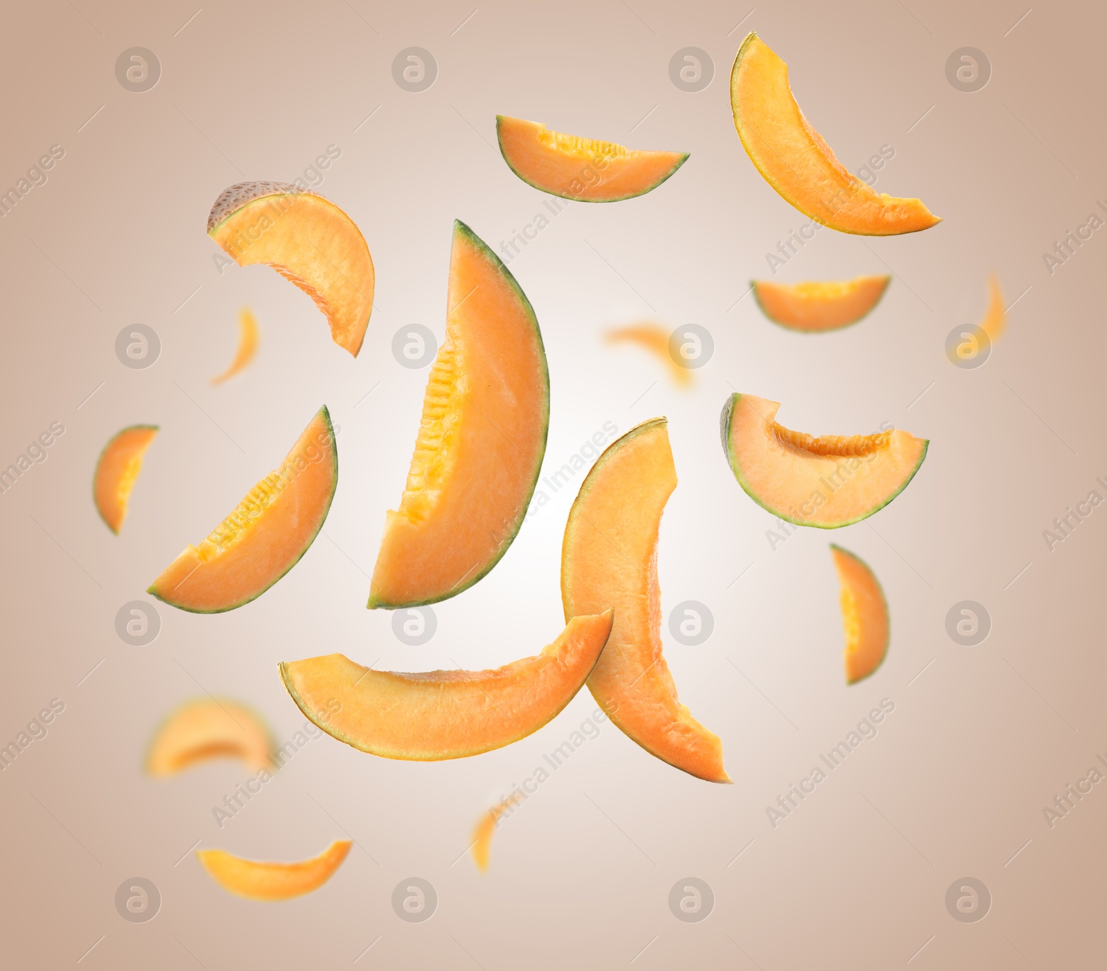 Cut fresh ripe melons swirling in air against color gradient background Image of Cut fresh ripe melons swirling in air against color gradient background