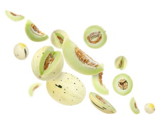 Image of Tasty ripe melons swirling in air against white background