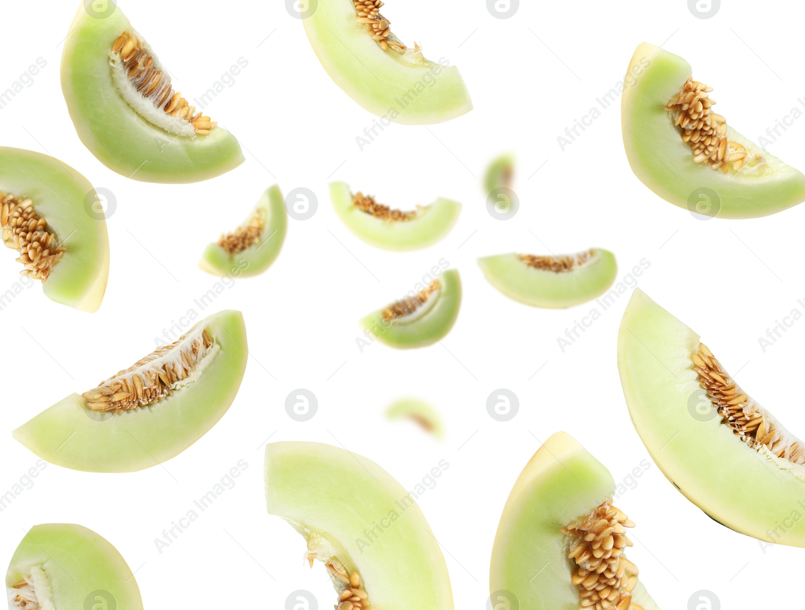 Cut fresh ripe melons swirling in air against white background Image of Cut fresh ripe melons swirling in air against white background
