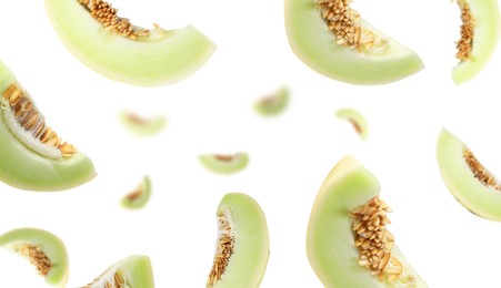 Image of Cut fresh ripe melons swirling in air against white background