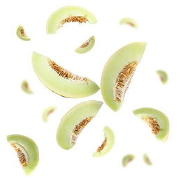 Image of Cut fresh ripe melons swirling in air against white background