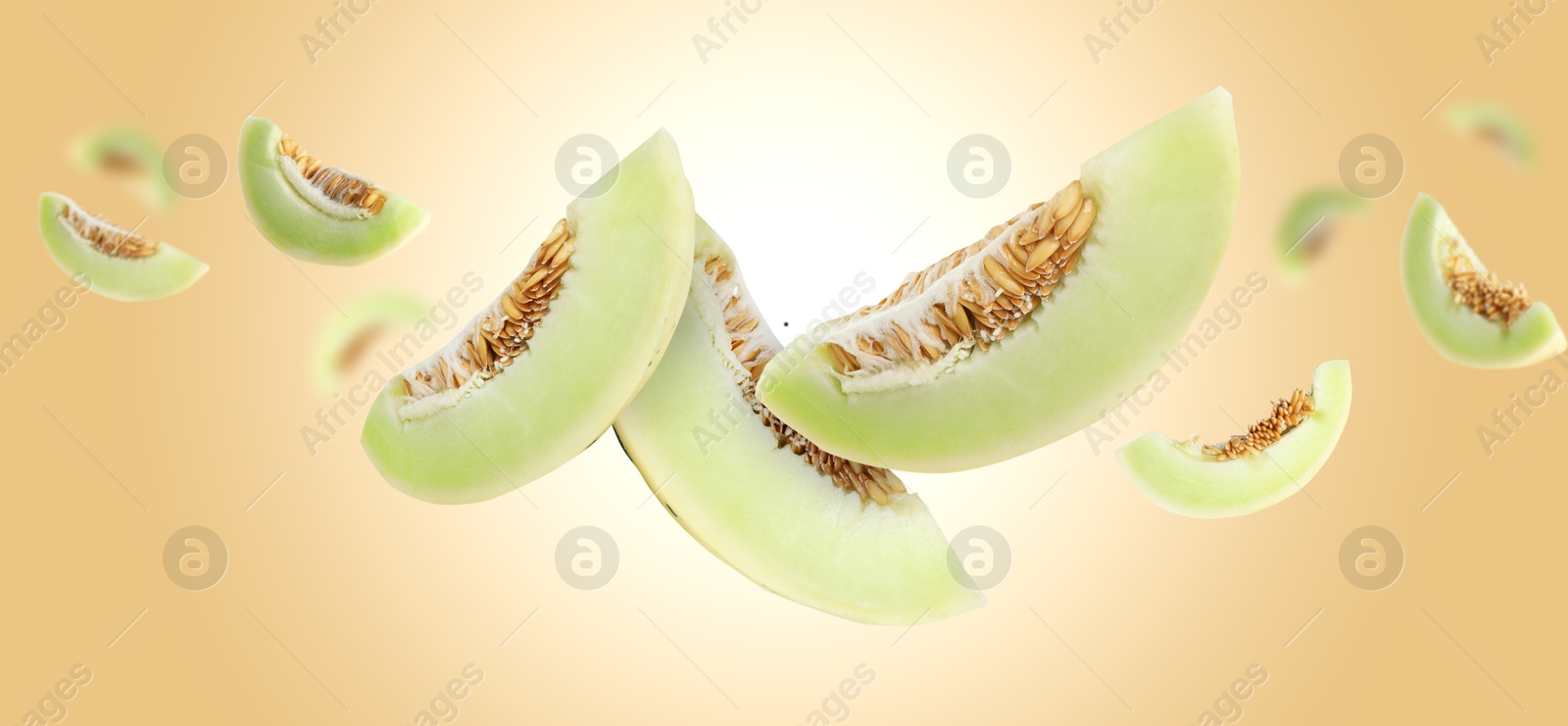 Cut fresh ripe melons swirling in air against beige gradient background Image of Cut fresh ripe melons swirling in air against beige gradient background