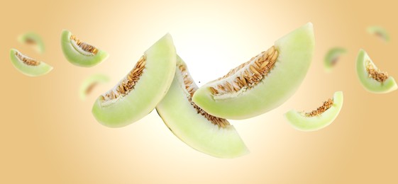 Image of Cut fresh ripe melons swirling in air against beige gradient background