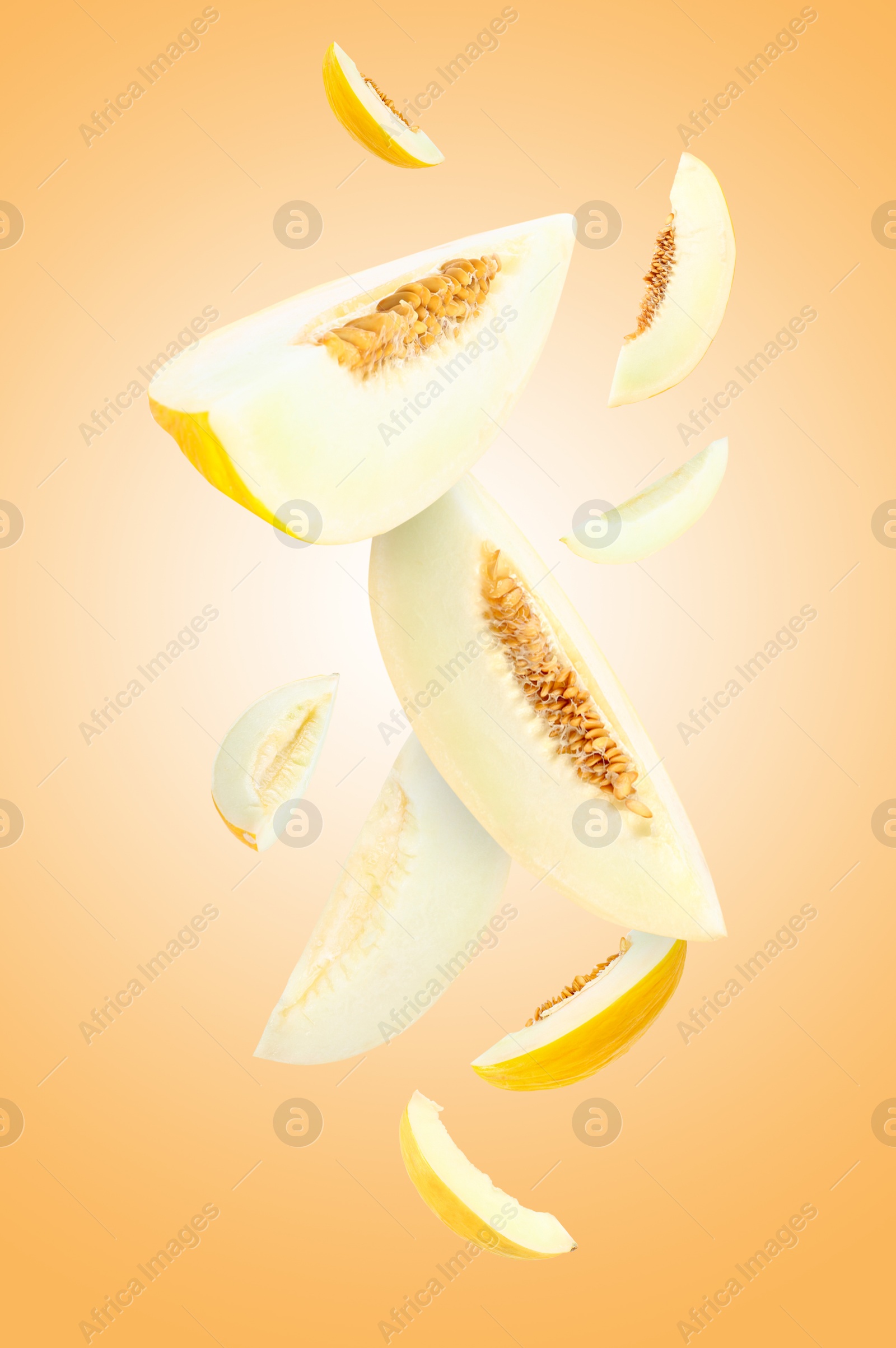 Cut fresh ripe melons swirling in air against beige gradient background Image of Cut fresh ripe melons swirling in air against beige gradient background