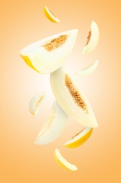 Image of Cut fresh ripe melons swirling in air against beige gradient background