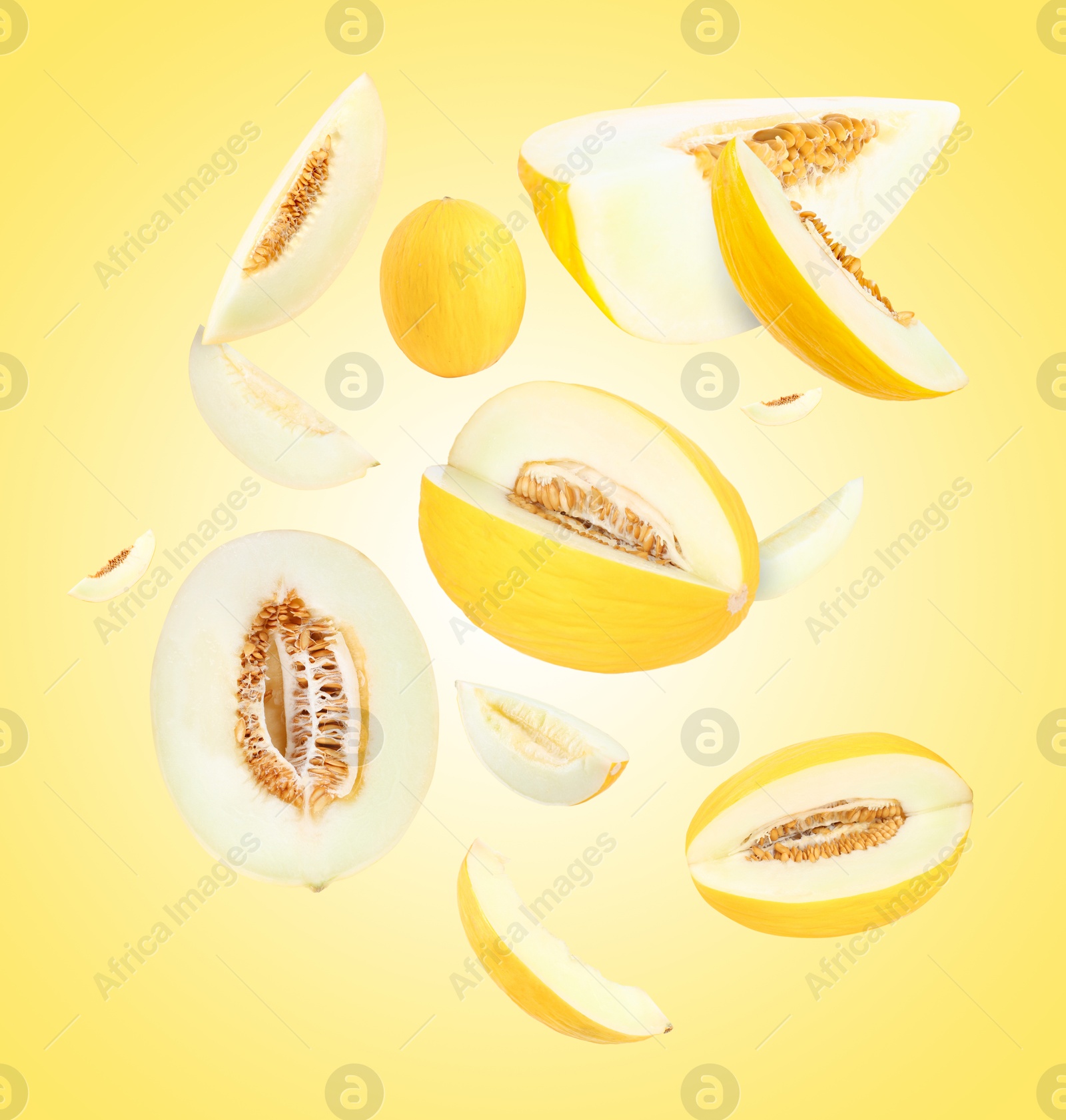 Tasty ripe melons swirling in air against yellow gradient background Image of Tasty ripe melons swirling in air against yellow gradient background