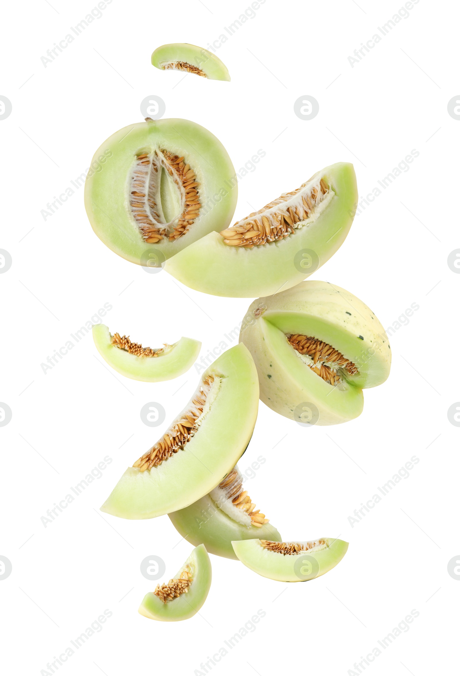 Cut fresh ripe melons swirling in air against white background Image of Cut fresh ripe melons swirling in air against white background
