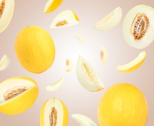 Image of Tasty ripe melons swirling in air against color gradient background