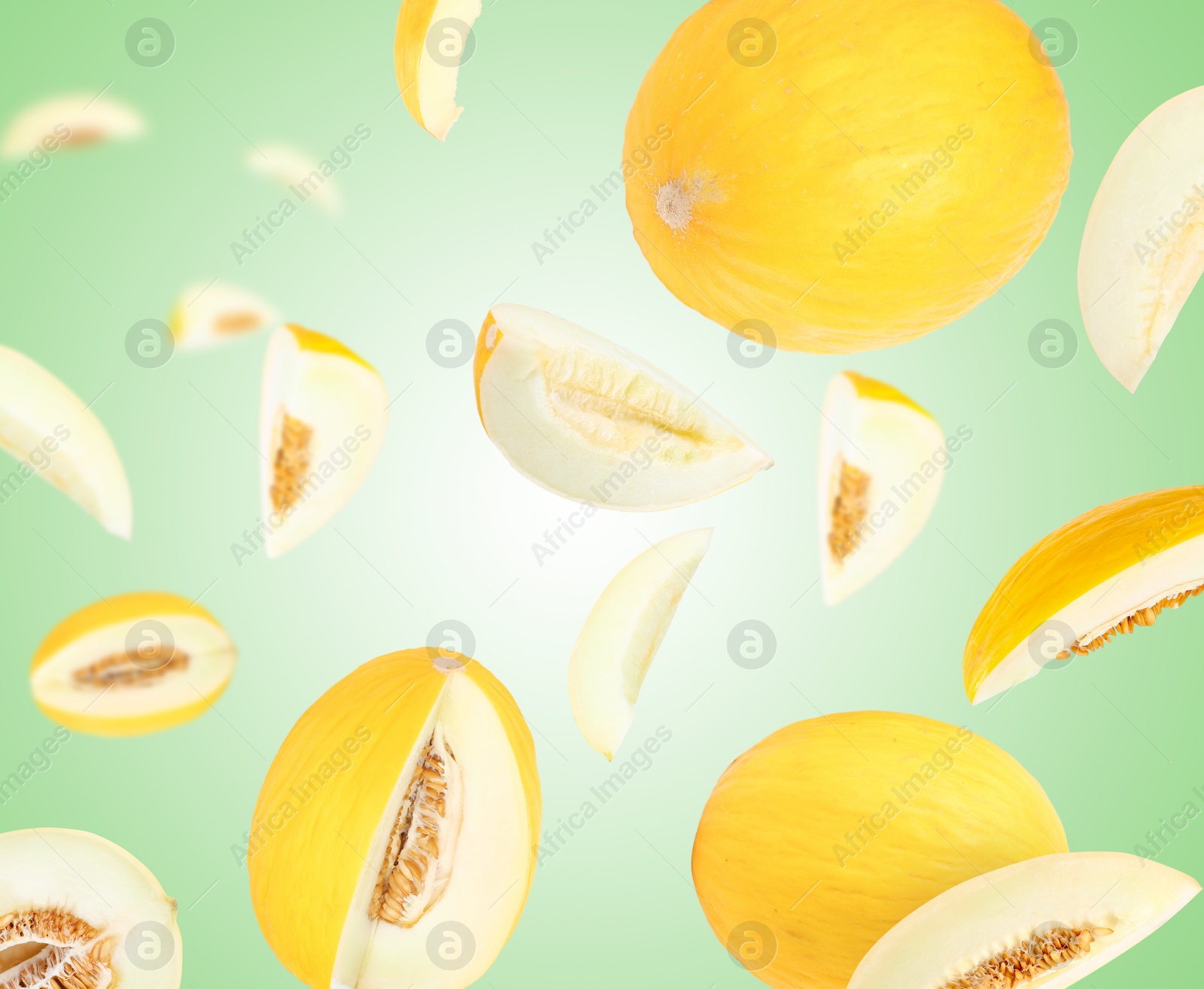 Tasty ripe melons swirling in air against green gradient background Image of Tasty ripe melons swirling in air against green gradient background