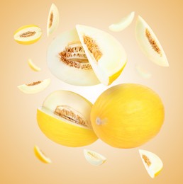 Image of Tasty ripe melons swirling in air against beige gradient background