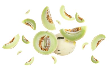 Image of Tasty ripe melons swirling in air against white background