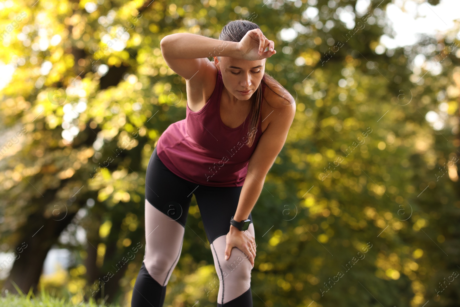 Athletic young woman in sportswear before running outdoors Photo of Athletic young woman in sportswear before running outdoors