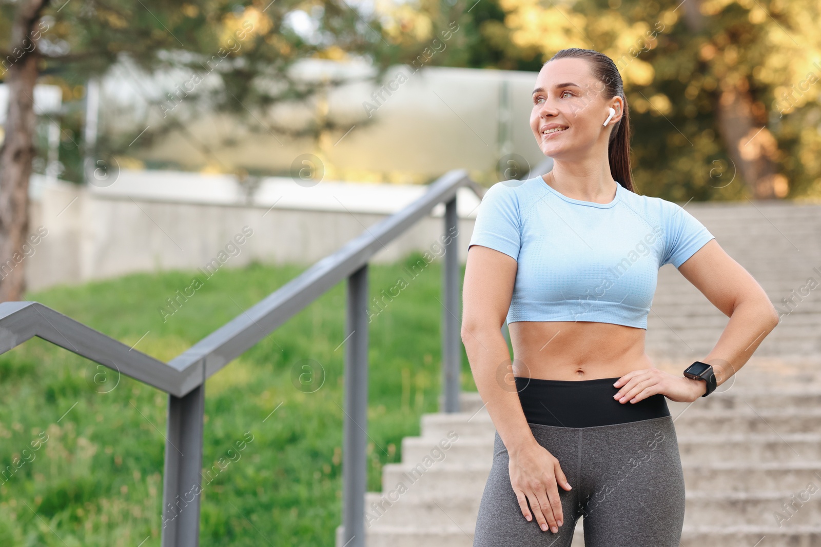 Athletic young woman in sportswear before running outdoors, space for text Photo of Athletic young woman in sportswear before running outdoors, space for text