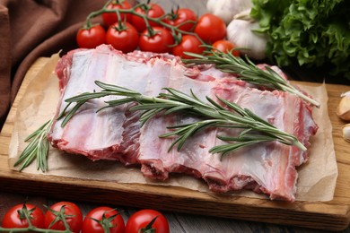 Photo of Fresh raw beef ribs and ingredients on table, closeup