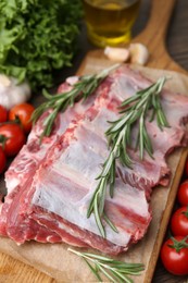 Photo of Fresh raw beef ribs and ingredients on table, closeup