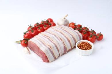 Photo of Piece of raw beef meat, tomatoes and spices on white background