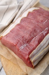 Photo of Piece of raw beef meat on table, closeup