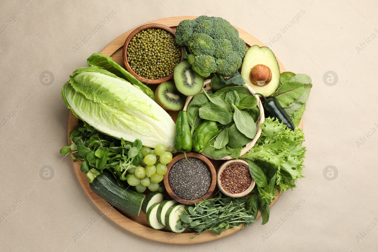 Superfood. Different healthy products on beige background, top view Photo of Superfood. Different healthy products on beige background, top view