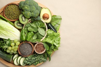 Photo of Superfood. Different healthy products on beige background, top view. Space for text