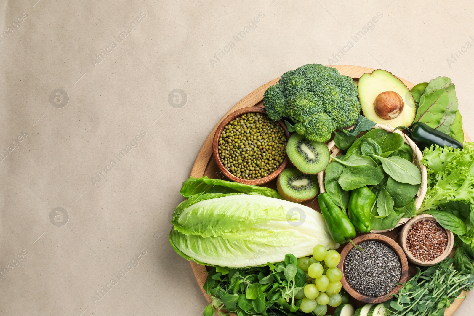 Superfood. Different healthy products on beige background, top view. Space for text Photo of Superfood. Different healthy products on beige background, top view. Space for text