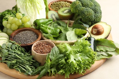 Photo of Superfood. Different healthy products on beige background, closeup