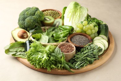 Photo of Superfood. Different healthy products on beige background, closeup