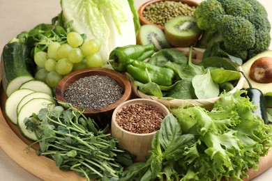 Photo of Superfood. Different healthy products on beige background, closeup