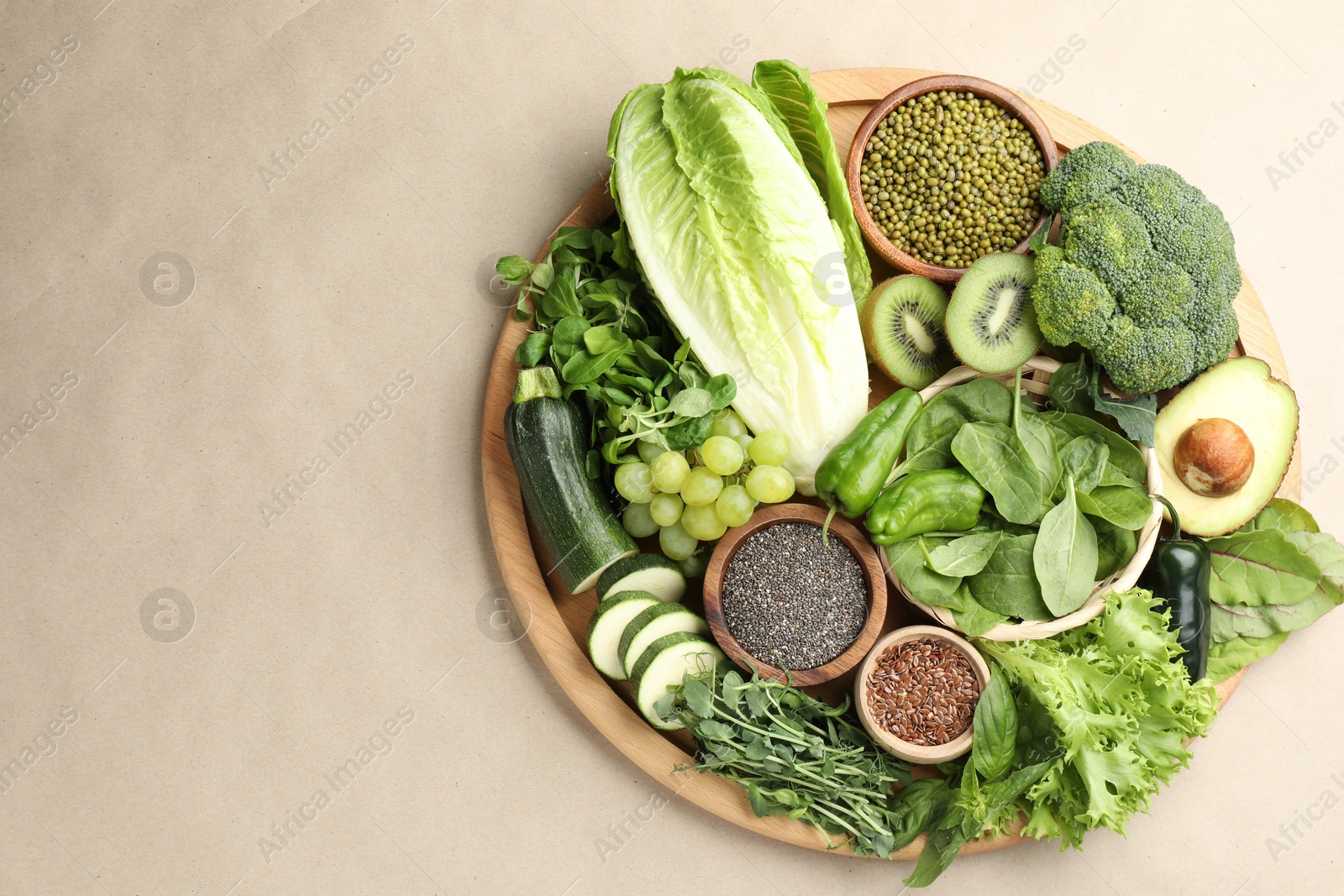 Superfood. Different healthy products on beige background, top view. Space for text Photo of Superfood. Different healthy products on beige background, top view. Space for text