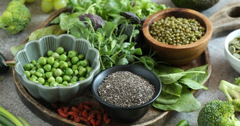Photo of Superfood. Different healthy products on grey table, closeup