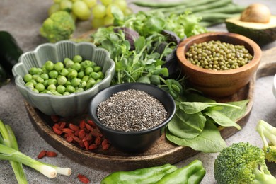 Photo of Superfood. Different healthy products on grey table, closeup