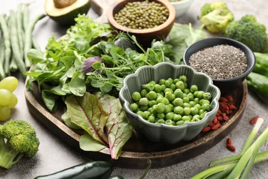 Photo of Superfood. Different healthy products on grey table, closeup