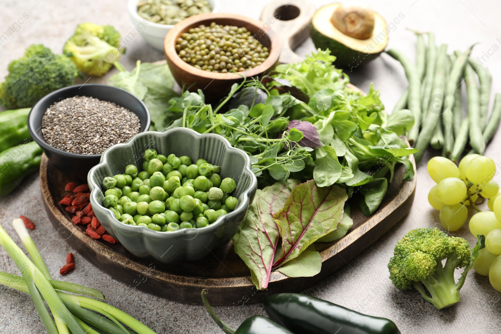 Photo of Superfood. Different healthy products on grey table, closeup
