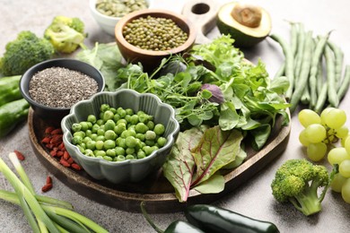 Photo of Superfood. Different healthy products on grey table, closeup
