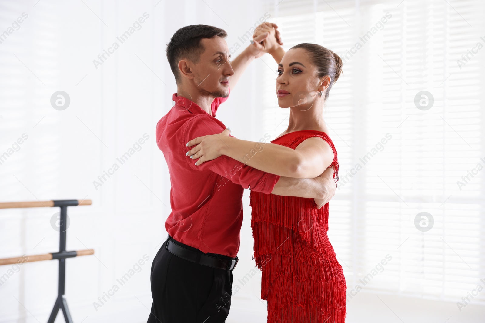 Couple of professional dancers training in studio Photo of Couple of professional dancers training in studio